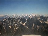 12 K2, Broad Peak, Gasherbrum IV, Gasherbrum I, Masherbrum On Flight From Islamabad To Skardu I can see a very large mountain in the hazy distance poking above the intervening mountains  K2! To the right of K2 is Broad Peak, the Gasherbrums, and to the right Masherbrum.